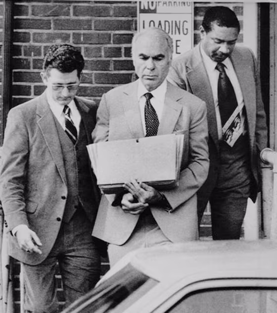 Former CIA agent Edwin P. Wilson is escorted from court in 1982 after his sentencing for selling arms to Libya.