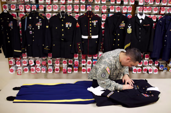 Image: Staff Sgt. Miguel Deynes prepared a final uniform