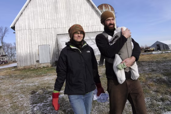 Image: Laura Frerichs with husband Andy and infant son Eli