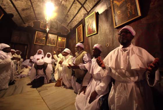 Image: Christmas eve prayers in Churchof the Nativity in Bethlehem