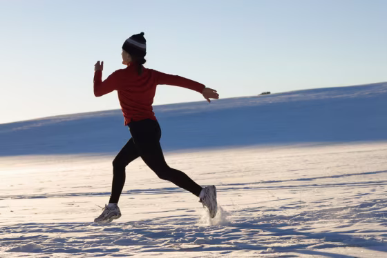 Image: woman running in snow