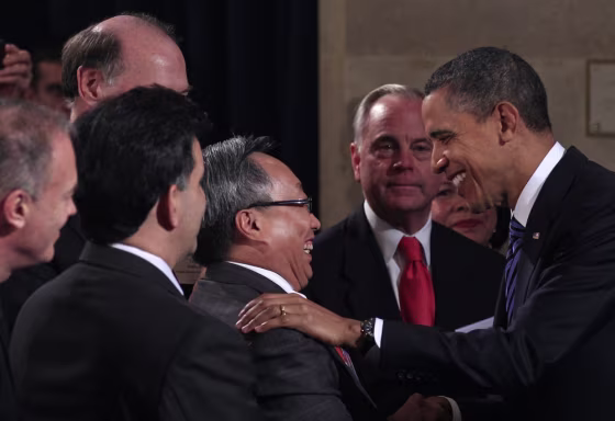 Image: U.S. President Barack Obama greets guests after addressing the U.S. Chamber of Commerce in Washington