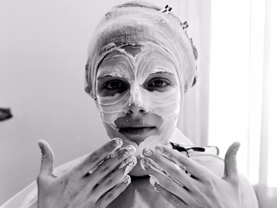Image: woman applying face Cream
