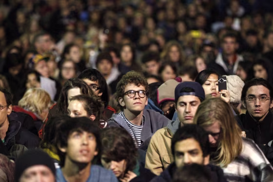 Image: A contingent of Occupy Cal demonstrators listens as UC Berkeley professor and former U.S. Secretary of Labor Robert Reich speaks on the steps outside Sproul Hall in Berkeley.