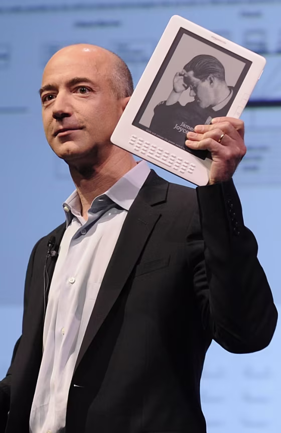 Amazon.com CEO Jeff Bezos unveils the Kindle DX, a large-screen version of its popular Kindle electronic reader designed for newspapers, magazines and textbooks, during a press conference in New York on May 6. 