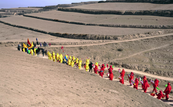 Chinese farmers parade during a ritual for good weather in Gansu province on Feb. 4, the start of spring in the Chinese lunar calendar.