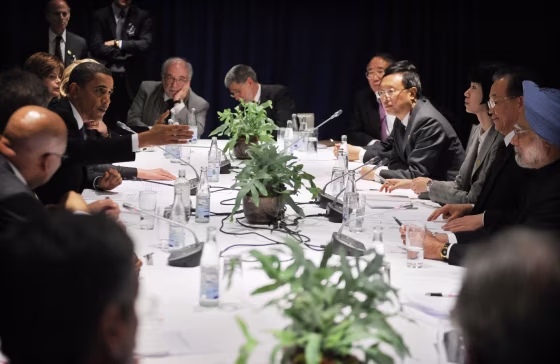U.S. President Barack Obama&nbsp;speaks during talks Friday&nbsp;with Chinese Premier Wen Jiabao, Indian Prime Minister Manmohan Singh, both far right, and several other leaders in Copenhagen.