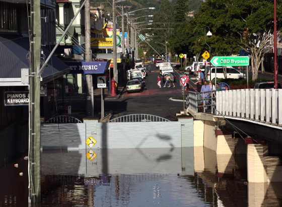 Floodwaters are held back by a section of the levee in Lismore, Australia, on Friday.&nbsp;Some 5,000 people in the city were ordered to evacuate Friday. 