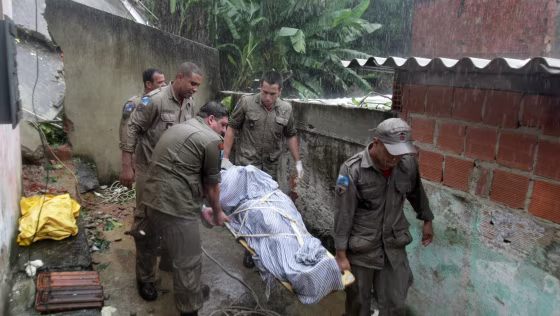 Members of a rescue team carry the corpse of a victim of&nbsp;a mudslide&nbsp;in Rio de Janeiro, Brazil, on Thursday.
