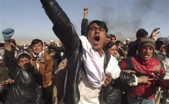 Afghan men shout anti-U.S. slogans during a demonstration against coalition forces in Ghazni, southwest of Kabul, on Friday.