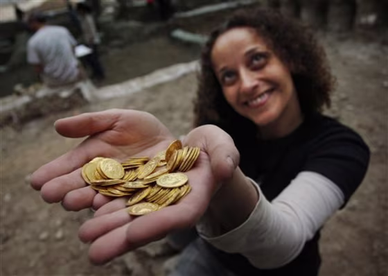 Israel's Antiquities Authority said a Byzantine-period hoard of coins was found in the ruins of a building where a striking 2,000-year-old gold earring from the Roman era was dug up last month.