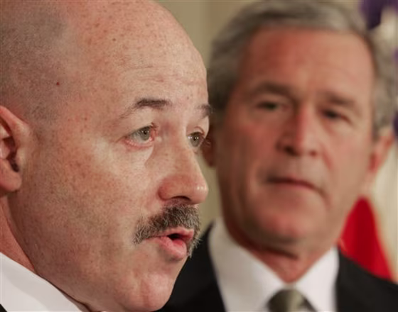 Former New York City Police Commissioner Bernard Kerik, left, speaks&nbsp;at the White House last week. Kerik made $6.7 million by selling stock given him by Taser International.