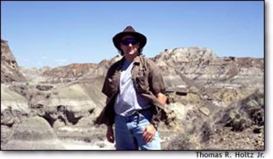 University of Maryland paleontologist Thomas R. Holtz Jr. looks over the fossil-rich strata at Dinosaur Provincial Park in Alberta. Holtz served as a consultant on "Walking With Dinosaurs" and "When Dinosaurs Roamed America," and wrote a "Jurassic Park" dinosaur guide.