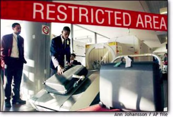 Security agents screen luggage at Los Angeles International Airport.