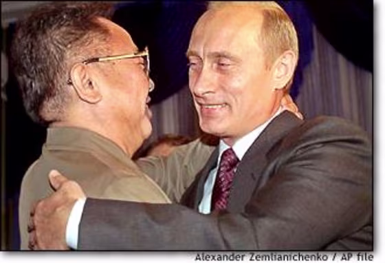 Russian President Vladimir Putin, right, smiles as he greets North Korean leader Kim Jong Il during their meeting in Vladivostok last month.