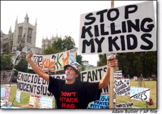 Brian Haw, peace protester, voices his message from his sidewalk home in front of Britain's Houses of Parliament.
