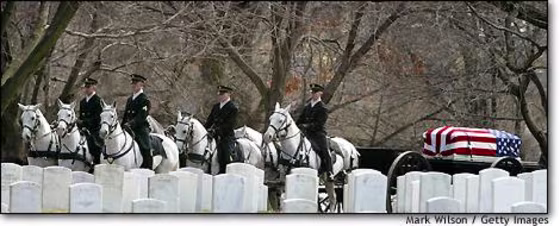 Horse-drawn caissons carry the casket of astronaut Lt. Col. Michael P. Anderson during a full honor funeral service Friday at Arlington National Cemetery in Virginia.