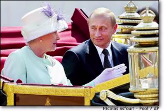 President Vladimir Putin, right, and Britain's Queen Elizabeth II, leave in an open carriage after Russian leader was given a ceremonial welcome on Horse Guards Parade in London on Tuesday.