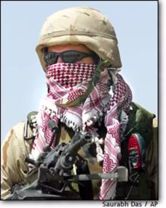 A U.S. soldier wears a traditional Arab scarf to protect himself from hot wind in Fallujah, west of Baghdad.