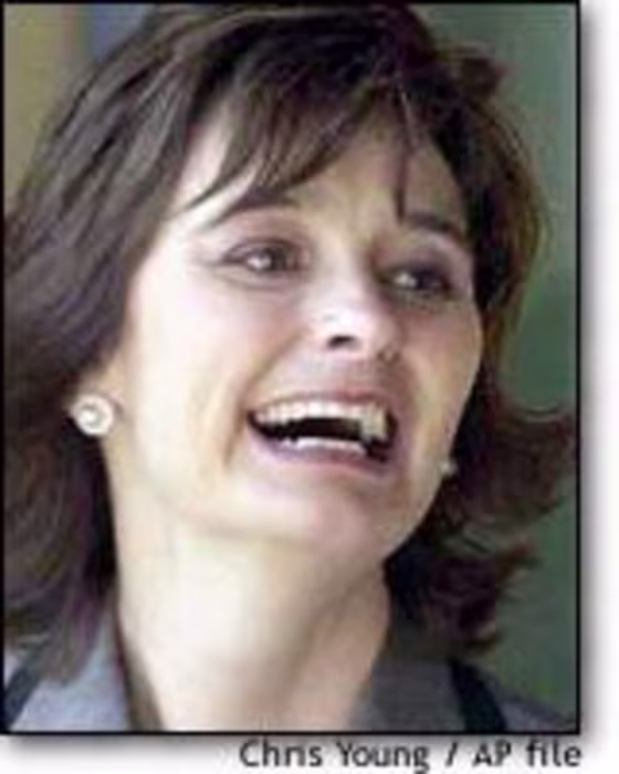 Cherie Blair, wife of British Prime Minister Tony Blair, has been criticized for allowing a photographer into the private quarters of Downing Street.