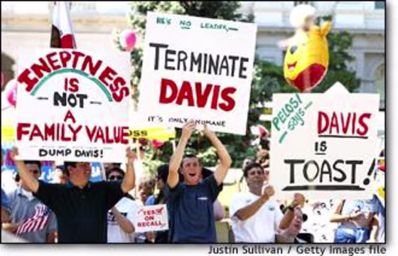 Recall supporters displayed signs in front of the State Capitol in Sacramento, Calif., during a rally in July.