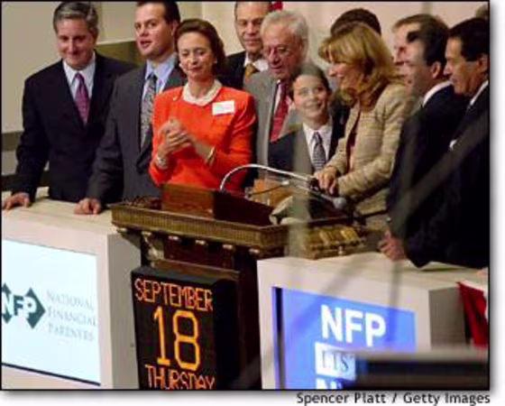 NYSE co-president Catherine Kinney, in red, hosts the opening bell ceremony Thursday, one day after the resignation of her boss, Chairman Dick Grasso.
