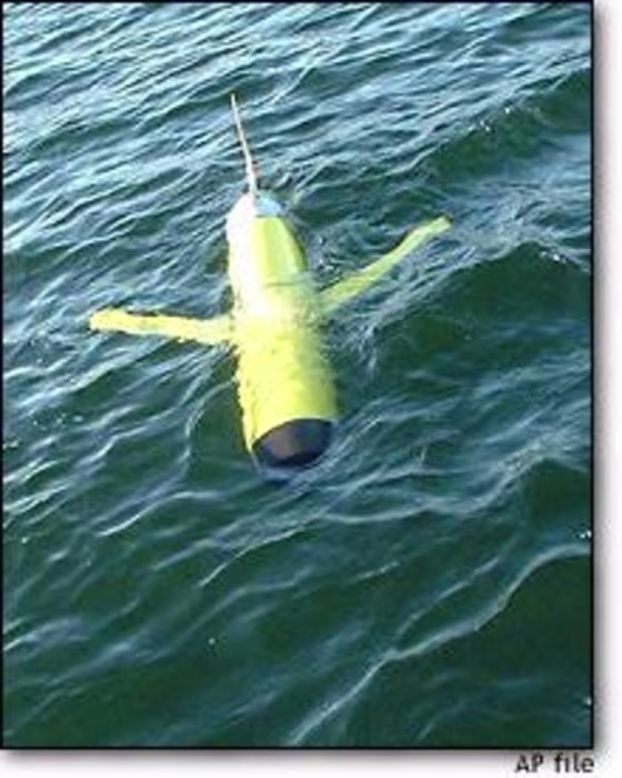 An ocean glider from Webb Research Corp. goes through its paces off the coast of East Falmouth, Mass. The battery-powered gliders have lured the interest of marine scientists and military technologists.