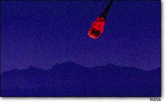 This artist's conception, prepared by NASA, shows a meteorite blazing toward Earth. Scientists say that objects mere tens of yards (meters) across could not create a global catastrophe, but they could still wreak more damage than an atomic bomb under certain conditions.