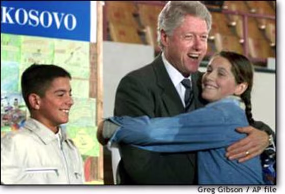 President Clinton hugs a young ethnic Albanian student during his post-war visit to Kosovo in 1999.