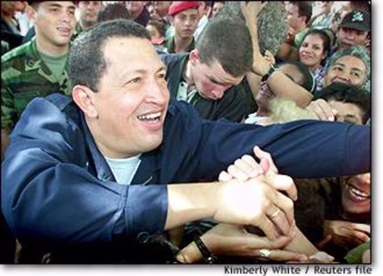 Venezuelan President Hugo Chavez greets supporters during a referendum campaign that gave him sweeping powers in December 2000.