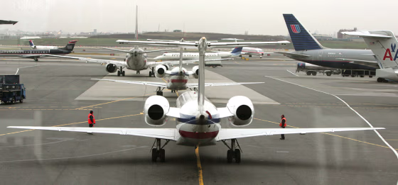 Image: Airplanes line up for take-off on one of LaGuardia Airport's two runways