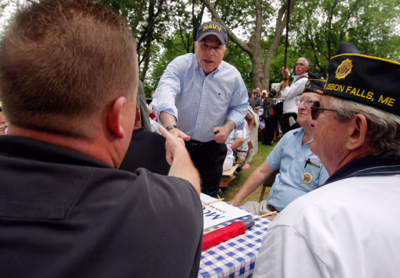 Image: Republican presidential candidate U.S. Senator McCain greets veterans in the audience at a campaign picnic outside the Maine Military Museum in South Portland