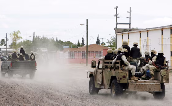 Image: Mexican Army soldiers patrol the streets of Ojinaga, Mexico