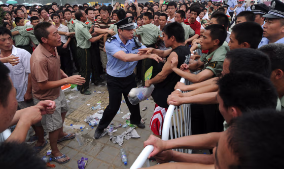 Image: Thousands of people waiting to buy the final batch of Olympic tickets