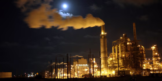Image: A full moon rises over the Valero refinery in Port Arthur, Texas.
