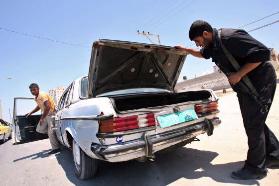 Hamas security forces inspect cars in Gaza City on Sunday. 