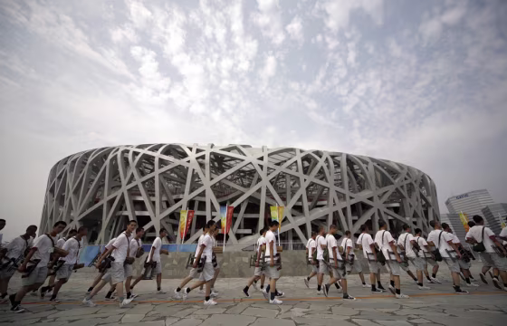 Image: Performers arrive for a rehearsal of the opening ceremony at the National Stadium ahead of the Beijing 2008 Olympic Games