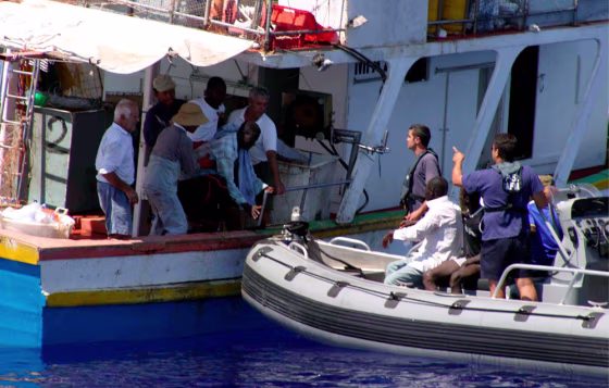 Image: African illegal immigrants being helped by Armed Forces of Malta