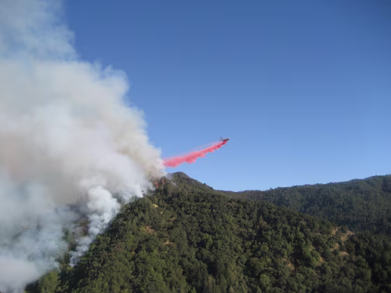 A DC-10 drops fire retardant on part of the fire in the Los Padres National Forest.