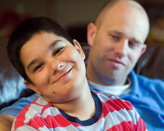 Image: Scott Southworth, right, is seen with his adopted son, Ala'a