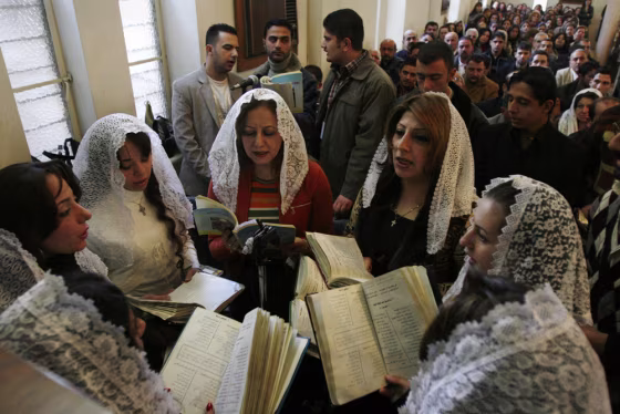 Iraqi Christians attend Mass in Baghdad on Tuesday.