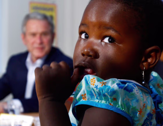 Image: Child attends a roundtable session with US President Bush in Dar es Salaam