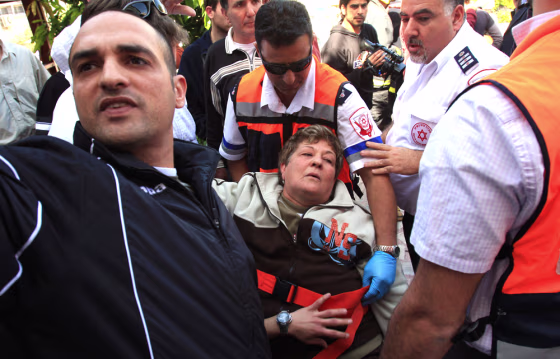 Image: An Israeli woman is treated for shock