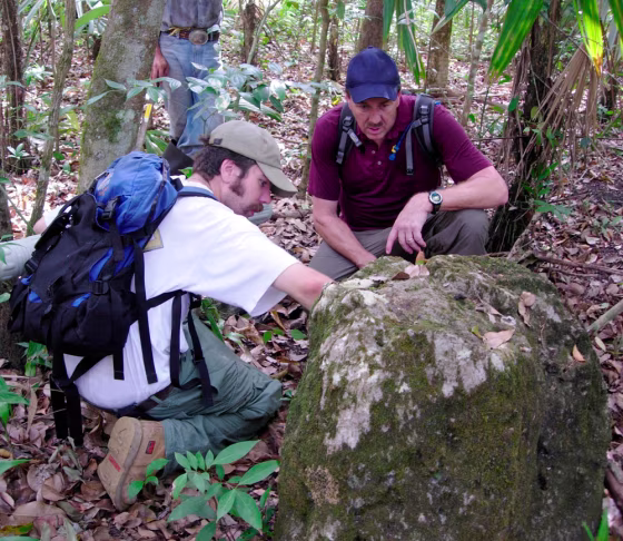 Image: Undated handout photo shows NASA archaeologist Tome Sever and graduate student Rob Griffin study stone pryramid