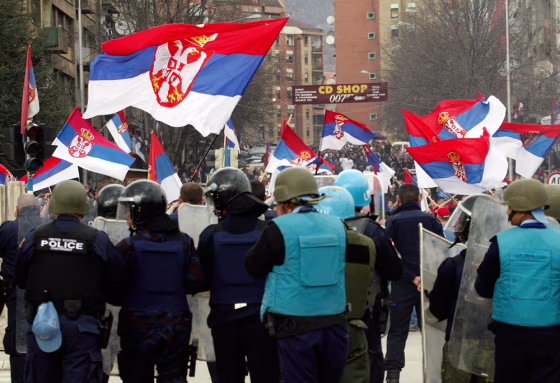 Image: Serb protesters face riot police in Mitrovica, Kosovo.