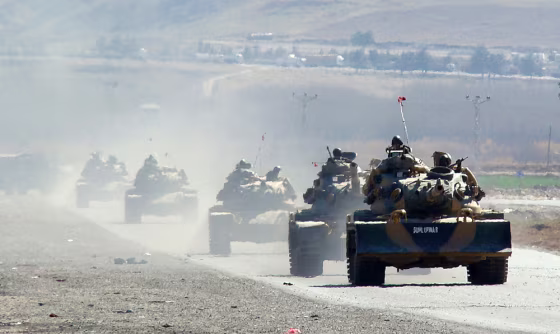 Image: Turkish tanks move near the Iraq border.