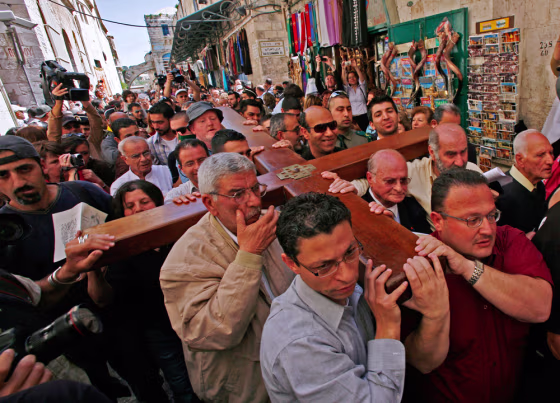 Image: Thousands of Christians from all over the world crowd the stone alleyways of Jerusalem's Old City.