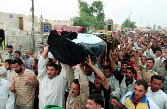 Image: Mourners chant slogans during a funeral for Riyadh al-Nuri in Najaf