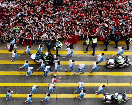 Image: The Olympic torch makes its way through Hong Kong