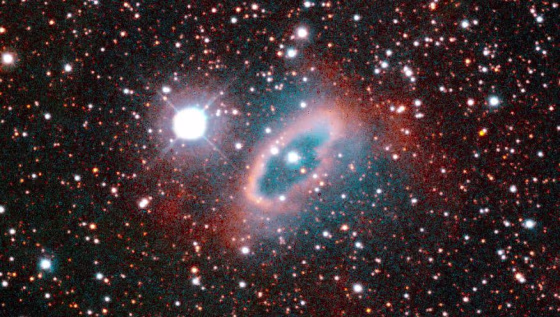 This image of the planetary nebula SuWt 2 reveals a bright ring-like structure encircling a bright central star. The central star is actually a close binary system where two stars completely circle each other every five days. The interaction of these stars and the more massive star that sheds material to create the nebula formed the ring structure. The burned out core of the massive companion has yet to be found inside the nebula. The nebula is located 6,500 light-years from Earth in the direction of the constellation Centaurus. This color image was taken on Jan. 31, 1995 with the National Optical Astronomy Observatory's 1.5-meter telescope at the Cerro Tololo Inter-American Observatory in Chile.